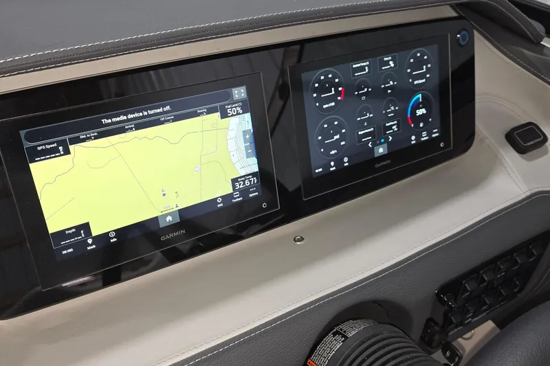Slide: The Image of Dashboard of 2023 Regal LS4 boat featuring dual Garmin navigation screens. - 6
