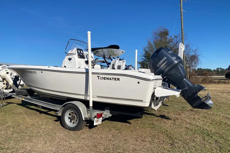 The Image of 2014 Tidewater 196 CC Adventure boat on trailer with Yamaha outboard motor. - 1