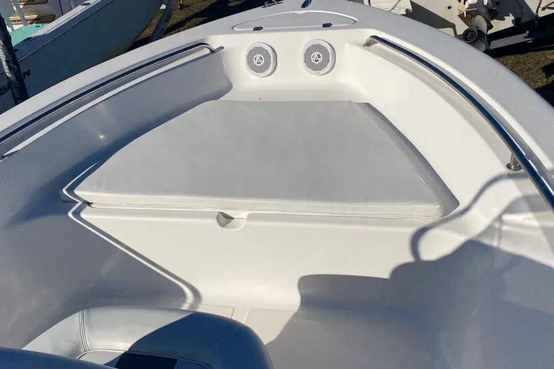 Slide: The Image of 2014 Tidewater 196 CC Adventure boat interior with cushioned seating and speakers. - 3