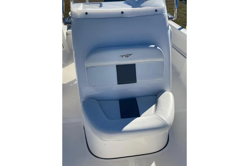 Slide: The Image of 2014 Tidewater 196 CC Adventure boat seat with white and blue upholstery. - 4