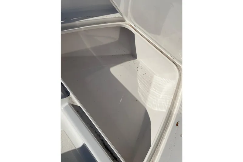 Slide: The Image of Open storage compartment on 2014 Tidewater 196 CC Adventure boat. - 5