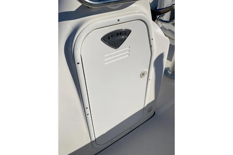 Slide: The Image of 2014 Tidewater 196 CC Adventure boat console with storage compartment. - 6