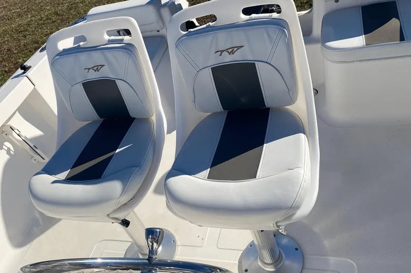 Slide: The Image of 2014 Tidewater 196 CC Adventure boat seats with blue and white upholstery. - 9