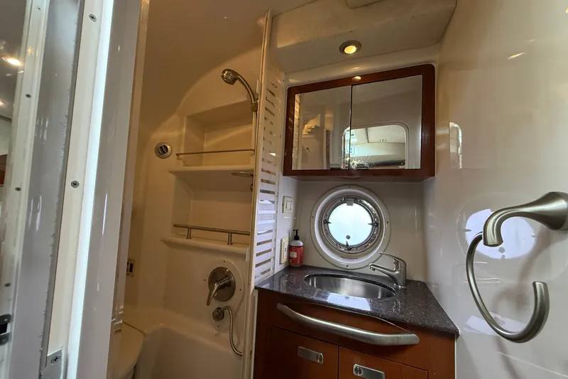 Slide: The Image of Luxurious bathroom interior of 2012 Sea Ray 370 Sundancer yacht with modern fixtures. - 26
