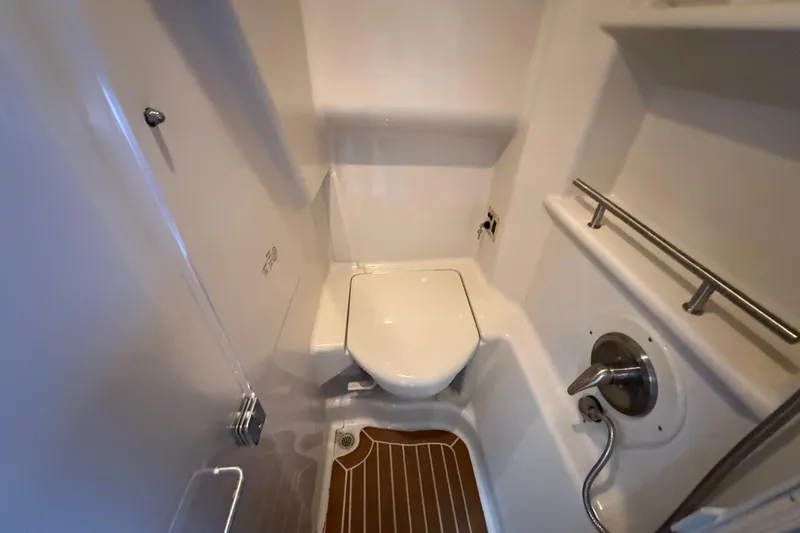 Slide: The Image of Compact bathroom in 2012 Sea Ray 370 Sundancer yacht with modern fixtures. - 29