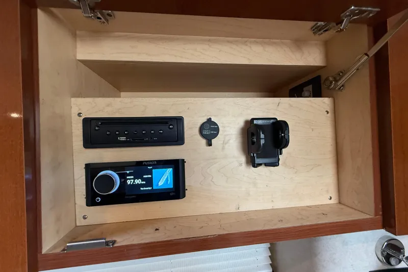 Slide: The Image of Cabinet with audio system in 2012 Sea Ray 370 Sundancer boat. - 32