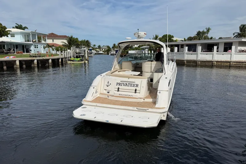 Slide: The Image of 2012 Sea Ray 370 Sundancer yacht cruising in a residential canal. - 4