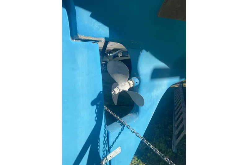 Slide: The Image of Propeller of 1984 Morgan 384 sailboat, blue hull, outdoor setting. - 17