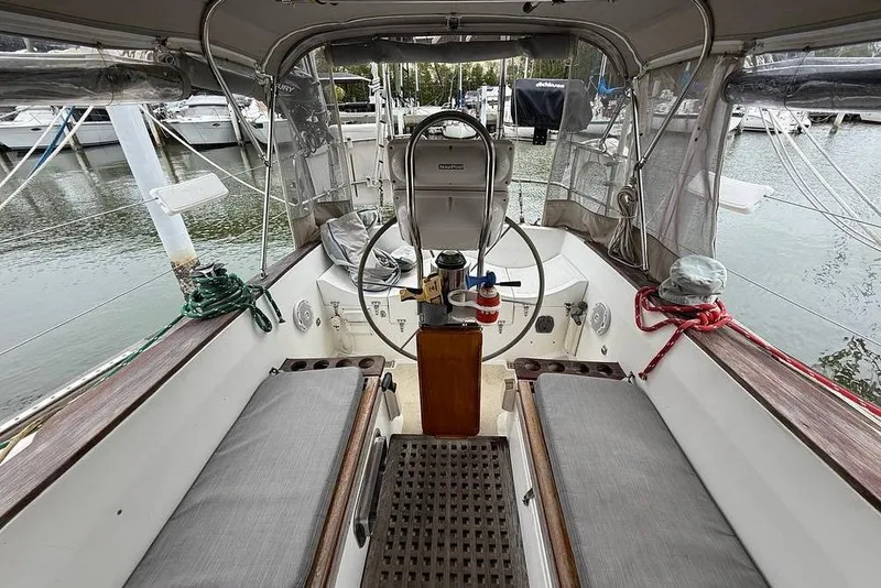 Slide: The Image of Cockpit of a 1984 Morgan 384 sailboat docked at a marina. - 23