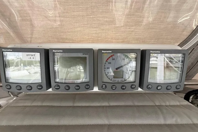 Slide: The Image of Raymarine navigation instruments on a 1984 Morgan 384 sailboat dashboard. - 46