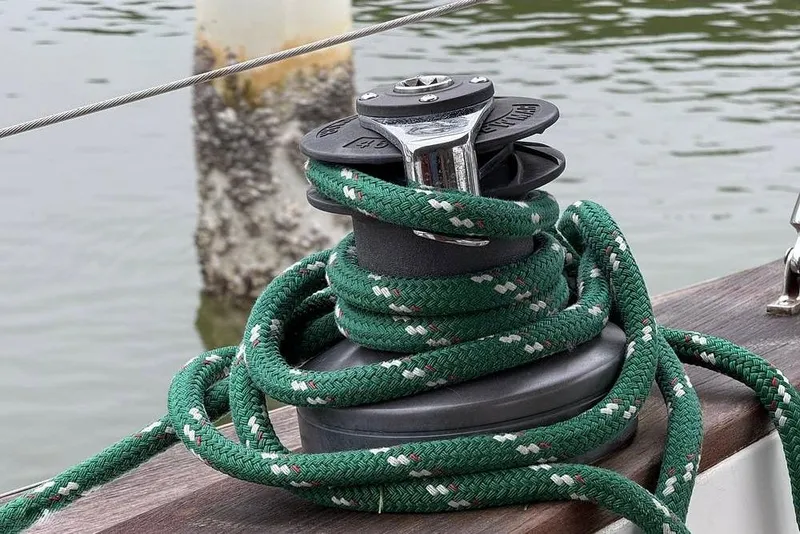 Slide: The Image of Green rope on a winch aboard a 1984 Morgan 384 sailboat. - 52