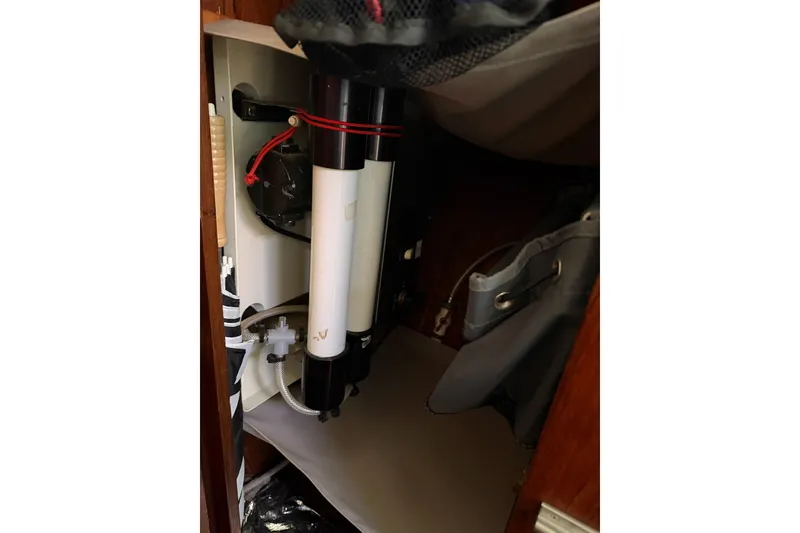 Slide: The Image of 1984 Morgan 384 yacht interior showing plumbing and storage compartment. - 61