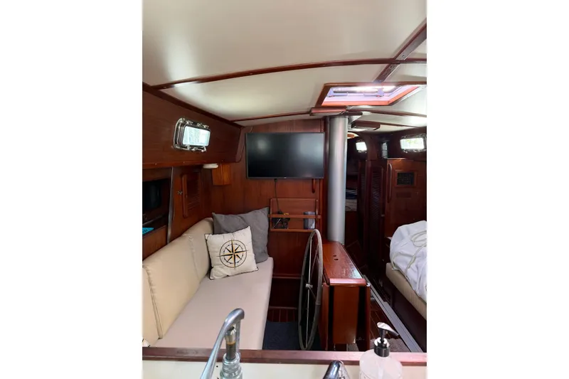 Slide: The Image of Interior of 1984 Morgan 384 sailboat with cozy seating and nautical decor. - 66