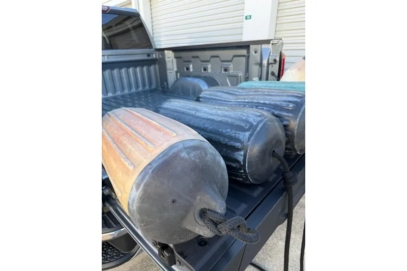 Slide: The Image of Truck bed with boat fenders, Morgan 384, 1984 model. - 76