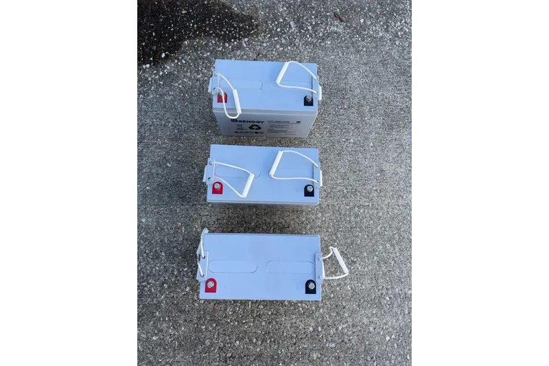 Slide: The Image of Three Renogy batteries on concrete, suitable for Morgan 384, 1984 model. - 79