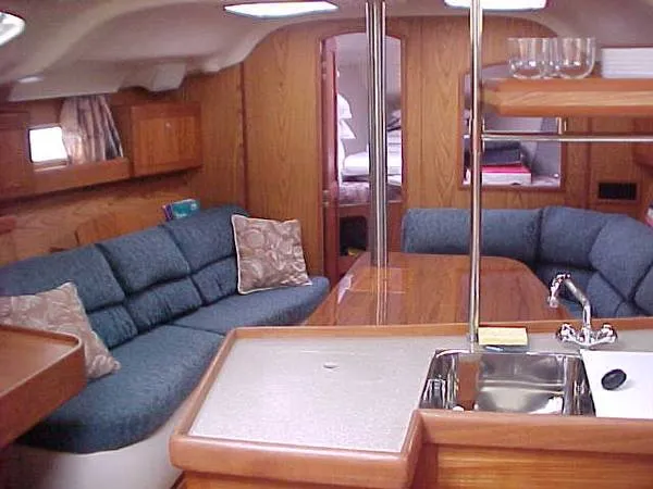 Slide: The Image of Interior of a 2000 Hunter 380 yacht with blue upholstery. - 10