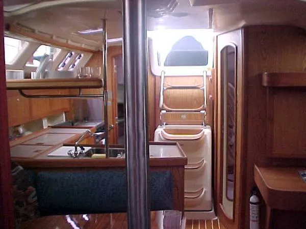 Slide: The Image of Interior of a 2000 Hunter 380 yacht with wooden furnishings. - 13