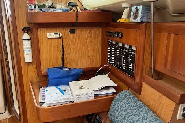 Slide: The Image of Interior of a 2000 Hunter 380 sailboat with navigation station and equipment. - 15