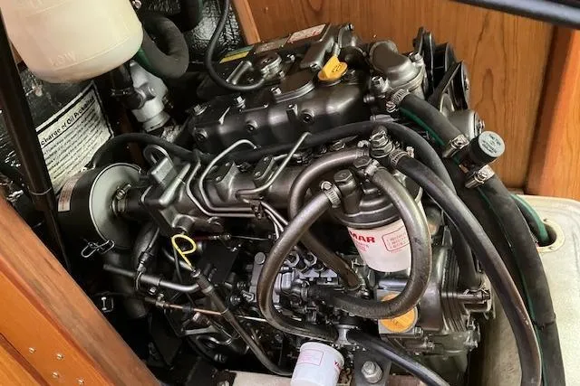 Slide: The Image of Engine of a 2000 Hunter 380 sailboat, showcasing intricate mechanical components. - 26