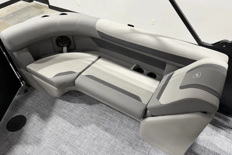 Slide: The Image of 2026 Premier 220 Sunscape RF-CL boat interior with gray seating and cup holders. - 10
