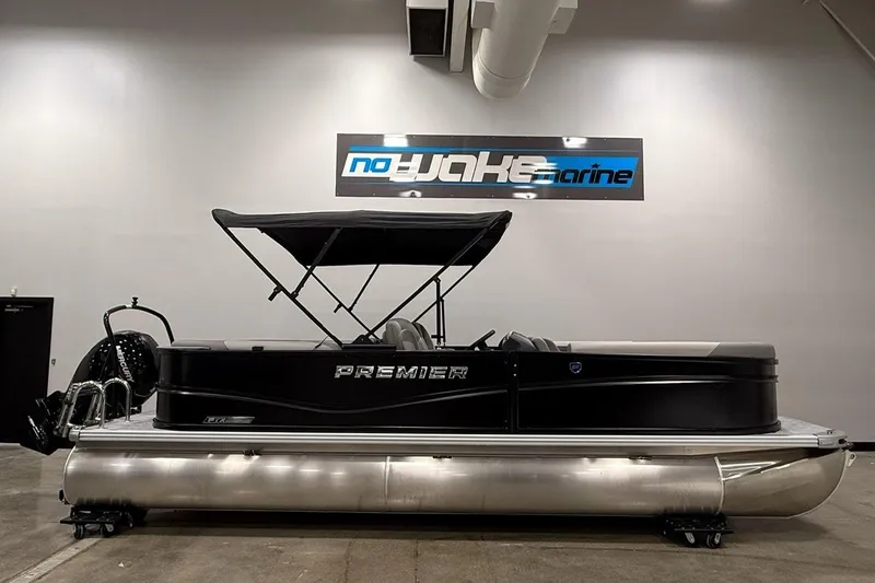 Slide: The Image of 2026 Premier 220 Sunscape RF-CL pontoon boat displayed indoors with canopy. - 2