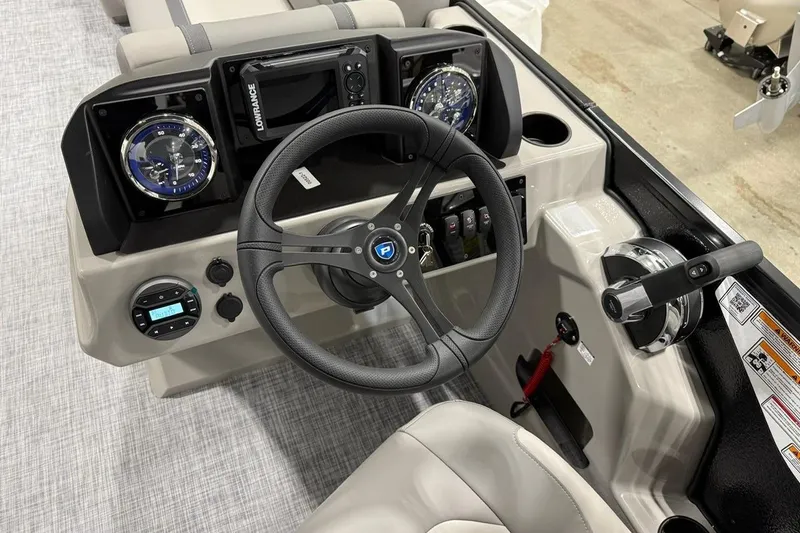 Slide: The Image of 2026 Premier 220 Sunscape RF-CL boat dashboard with steering wheel and controls. - 8