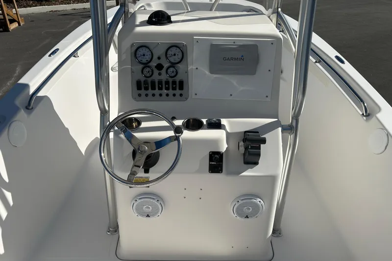 Slide: The Image of 2008 Tidewater 216 CC Adventure boat console with steering wheel and Garmin navigation system. - 11