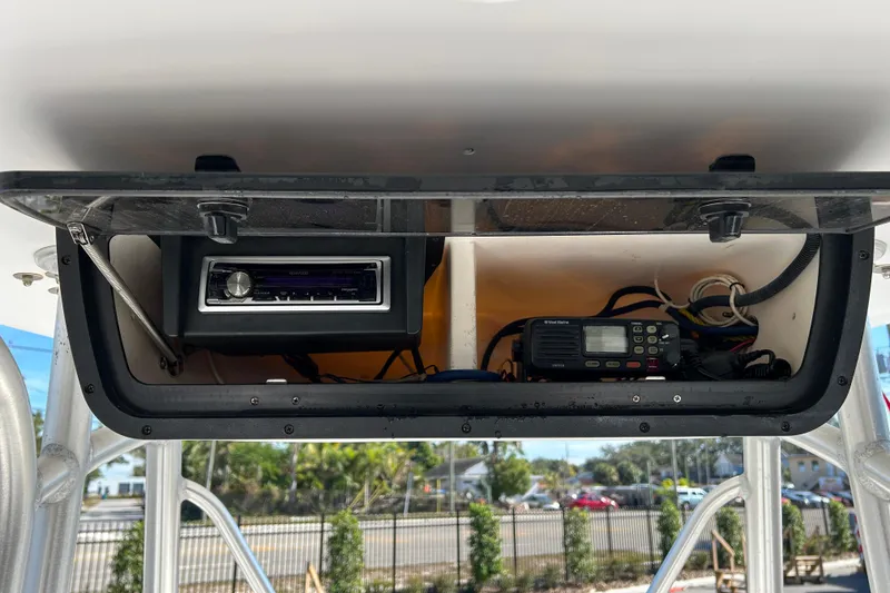 Slide: The Image of 2008 Tidewater 216 CC Adventure boat console with radio and communication equipment. - 16