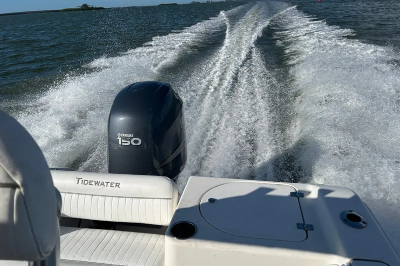 Slide: The Image of Tidewater 216 CC Adventure boat cruising with Yamaha 150 engine, 2008 model. - 21