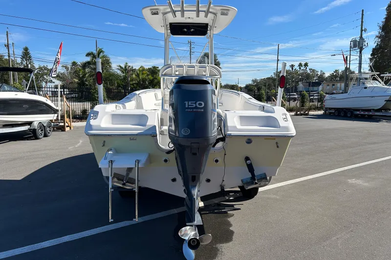 Slide: The Image of 2008 Tidewater 216 CC Adventure boat with Yamaha 150 engine, parked outdoors. - 3