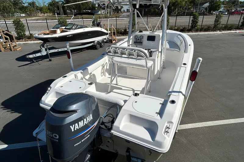 Slide: The Image of 2008 Tidewater 216 CC Adventure boat with Yamaha 150 engine in parking lot. - 7
