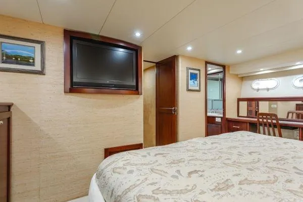 Slide: The Image of Luxurious cabin interior of a 1998 Pacific Mariner 65 yacht with elegant furnishings. - 14