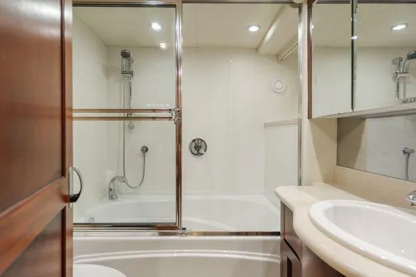 Slide: The Image of Luxurious bathroom in 1998 Pacific Mariner 65 yacht with shower and sink. - 17