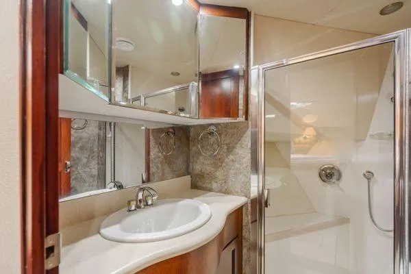 Slide: The Image of Luxurious bathroom in 1998 Pacific Mariner 65 yacht with modern fixtures and shower. - 19