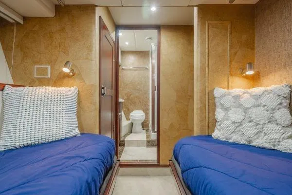 Slide: The Image of Interior of 1998 Pacific Mariner 65 yacht with twin beds and bathroom. - 21
