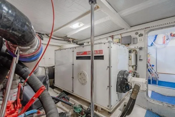 Slide: The Image of Engine room of a 1998 Pacific Mariner 65 yacht with generator and equipment. - 31