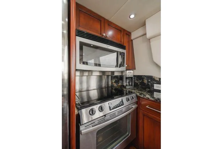 Slide: The Image of Galley kitchen in 1998 Pacific Mariner 65 yacht with stainless steel appliances. - 7