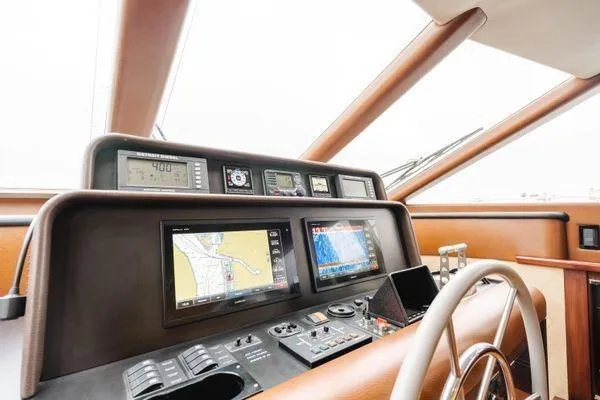 Slide: The Image of Cockpit of 1998 Pacific Mariner 65 yacht with navigation screens and controls. - 9