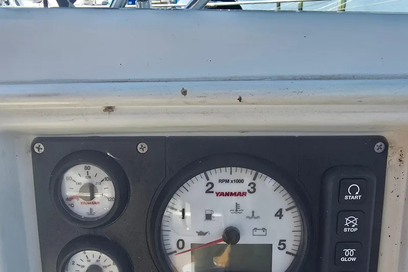 Slide: The Image of Control panel of a 1993 Hunter Legend 35.5 sailboat with Yanmar gauges and buttons. - 35