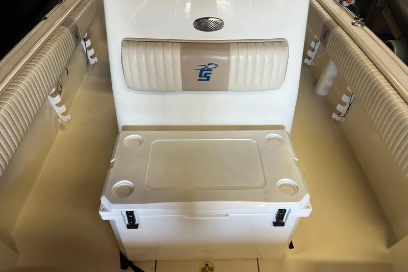 Slide: The Image of 2016 Carolina Skiff 23 Ultra Elite boat interior with seating and cooler. - 13