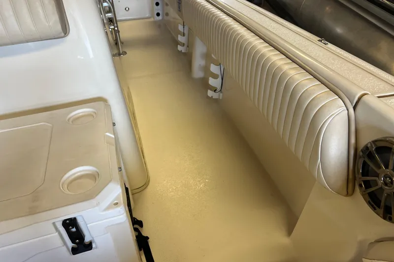 Slide: The Image of 2016 Carolina Skiff 23 Ultra Elite interior with cushioned seating and cup holders. - 15