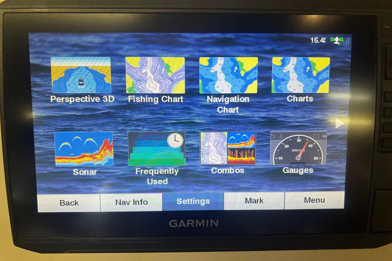 Slide: The Image of Garmin marine display showing navigation and sonar options on a 2016 Carolina Skiff 23 Ultra Elite. - 17