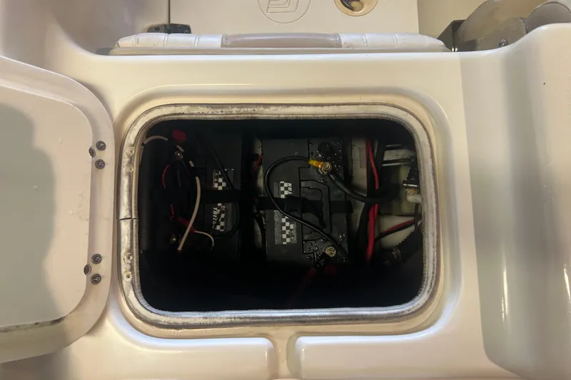 Slide: The Image of Battery compartment of a 2016 Carolina Skiff 23 Ultra Elite boat. - 25