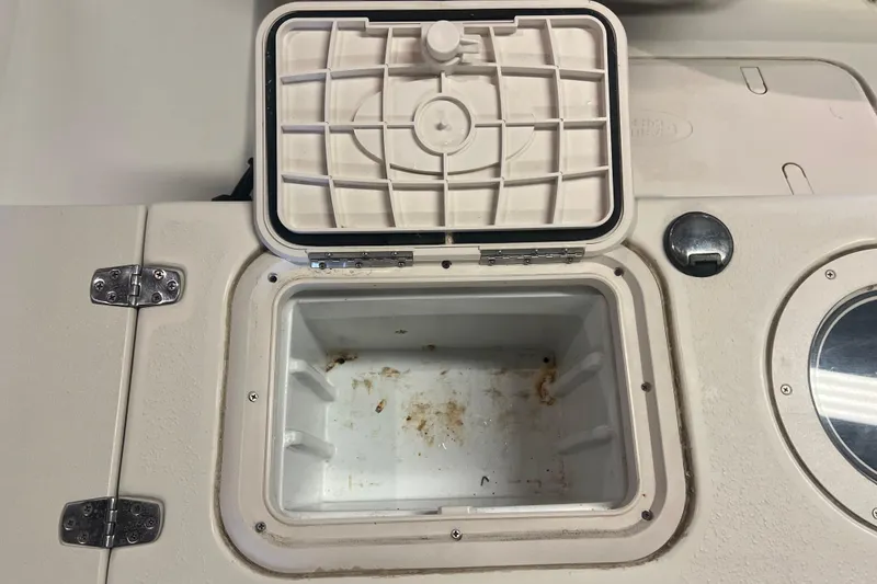 Slide: The Image of Open storage compartment on a 2016 Carolina Skiff 23 Ultra Elite boat. - 28