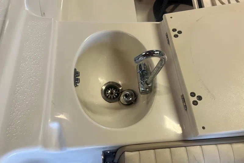 Slide: The Image of 2016 Carolina Skiff 23 Ultra Elite boat sink with chrome faucet. - 33