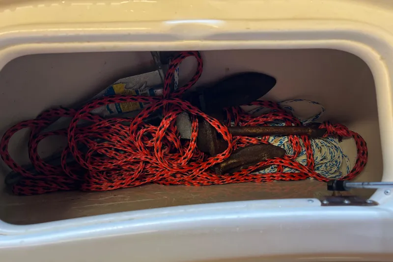 Slide: The Image of Storage compartment with ropes and anchor on 2016 Carolina Skiff 23 Ultra Elite boat. - 38