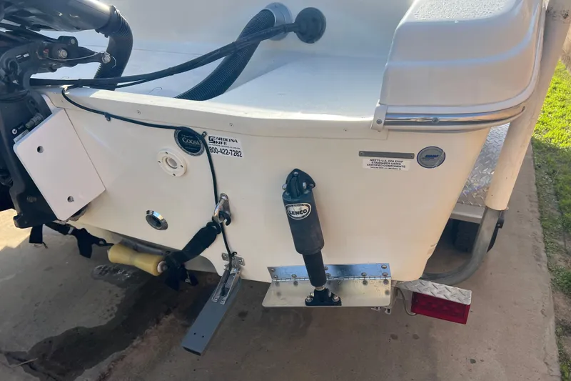 Slide: The Image of 2016 Carolina Skiff 23 Ultra Elite boat transom with motor and trailer. - 5