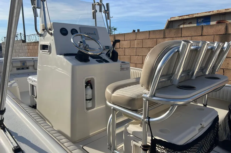 Slide: The Image of 2016 Carolina Skiff 23 Ultra Elite boat interior with steering console and seating. - 6