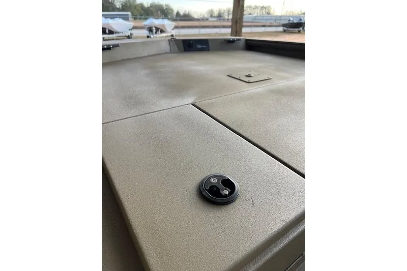 Slide: The Image of 2026 G3 Gator Tough 18 SC boat deck with latch detail. - 3