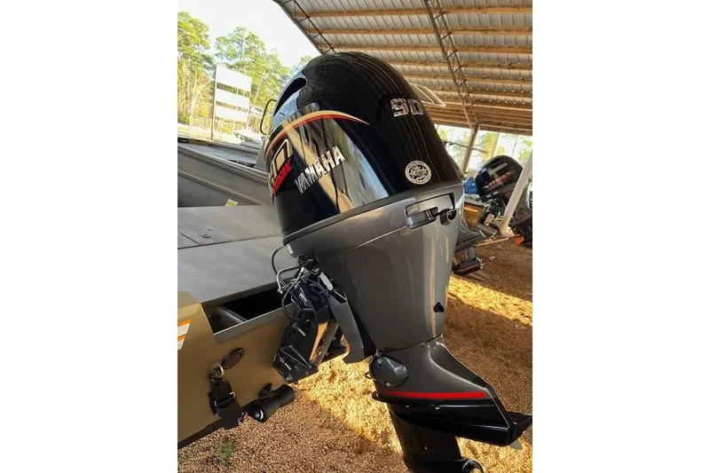 Slide: The Image of Yamaha outboard motor on 2026 G3 Gator Tough 18 SC boat, under a metal canopy. - 6
